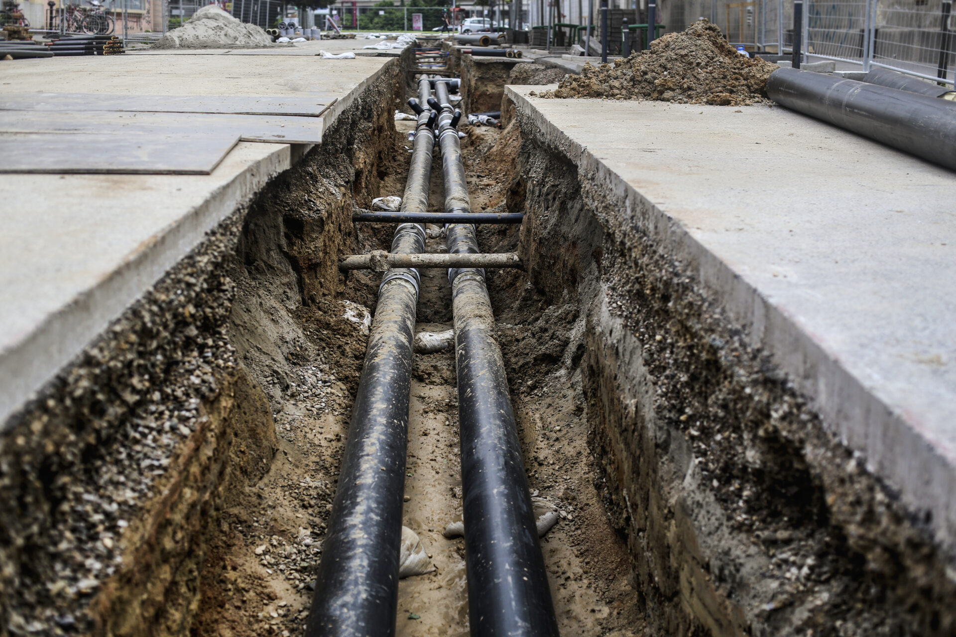 Heating and other pipeline in a hole on the street.